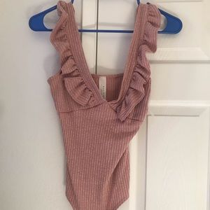 Pink body suit